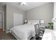Comfortable bedroom with a cozy bed, closet, and a well-lit desk near a bright window at 3006 S Legacy Park Blvd, Indian Land, SC 29707