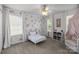 Cheerful bedroom featuring floral wallpaper accent, and a comfortable reading nook at 3006 S Legacy Park Blvd, Indian Land, SC 29707
