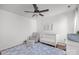 Bright Bedroom features a wood floor, plush rug, crib, rocker, and a changing table at 3006 S Legacy Park Blvd, Indian Land, SC 29707