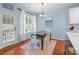 Charming dining area featuring wood floors, stylish lighting, and a view to the backyard at 3006 S Legacy Park Blvd, Indian Land, SC 29707