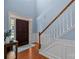 Welcoming entryway featuring hardwood floors, a staircase, and a beautiful wooden front door at 3006 S Legacy Park Blvd, Indian Land, SC 29707