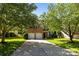 Beautiful brick home with a two-car garage and a spacious driveway shaded by mature trees at 3006 S Legacy Park Blvd, Indian Land, SC 29707