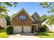 Charming brick home with a two-car garage, well-manicured lawn, and lovely landscaping at 3006 S Legacy Park Blvd, Indian Land, SC 29707