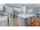 Open kitchen with stainless steel appliances, island with bar seating, and ample counter space at 3006 S Legacy Park Blvd, Indian Land, SC 29707