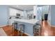Bright kitchen with white cabinetry, stainless appliances, and breakfast bar seating at 3006 S Legacy Park Blvd, Indian Land, SC 29707