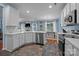 Updated kitchen with stainless steel appliances, white cabinets, and tile backsplash detail at 3006 S Legacy Park Blvd, Indian Land, SC 29707