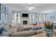 Bright and sunny living room with fireplace, built-in shelves, and cozy seating at 3006 S Legacy Park Blvd, Indian Land, SC 29707