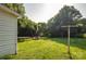 Large backyard featuring mature trees and green grass at 3220 Harmony Hwy, Harmony, NC 28634