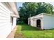 Spacious backyard featuring an outbuilding, grass, and trees at 3220 Harmony Hwy, Harmony, NC 28634