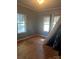 Bright bedroom with hardwood floors and ample natural light, offering a tranquil retreat at 3220 Harmony Hwy, Harmony, NC 28634