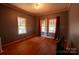 Bedroom featuring hardwood floors and multiple windows at 3220 Harmony Hwy, Harmony, NC 28634