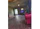 This living room features a red sofa, a fireplace and is equipped with a TV at 3220 Harmony Hwy, Harmony, NC 28634
