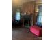 Comfortable living room features a brick fireplace and two lamps for added ambiance at 3220 Harmony Hwy, Harmony, NC 28634