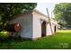 An outbuilding includes several bays with a ladder and a visible oil tank at 3220 Harmony Hwy, Harmony, NC 28634