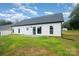Lush backyard offers a patio, privacy, and a serene outdoor space at 3486 Winters St, Newton, NC 28658