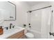 Modern bathroom boasts sleek fixtures, a soaking tub with shower, and a stylish vanity at 3486 Winters St, Newton, NC 28658