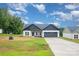 Charming home with a well-maintained lawn, two car garage, and inviting curb appeal at 3486 Winters St, Newton, NC 28658