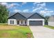Attractive home featuring a two car garage, covered porch, and new construction design at 3486 Winters St, Newton, NC 28658