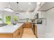 Well-lit kitchen with granite countertops, an island, and stainless steel appliances at 3486 Winters St, Newton, NC 28658
