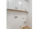 Functional laundry room with overhead cabinets and all necessary connections at 3486 Winters St, Newton, NC 28658