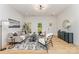 Open living room with neutral tones, stylish decor, hardwood flooring and lots of natural light at 3486 Winters St, Newton, NC 28658