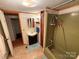 Full bathroom with tiled floor, vanity, toilet, and shower at 370 Miracle Dr, Salisbury, NC 28146