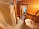 Bathroom featuring wood-paneled walls and a shower at 370 Miracle Dr, Salisbury, NC 28146