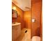 Bathroom with wood-paneled walls and white fixtures at 370 Miracle Dr, Salisbury, NC 28146