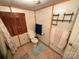 Bathroom featuring a toilet, window with shutters, and tile flooring at 370 Miracle Dr, Salisbury, NC 28146