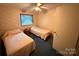 Bedroom featuring two beds, floral wallpaper, and a ceiling fan at 370 Miracle Dr, Salisbury, NC 28146
