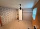 Small bedroom with mixed paneling featuring a small closet space at 370 Miracle Dr, Salisbury, NC 28146