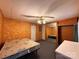 This bedroom features wood paneling and a closet with mirrored doors at 370 Miracle Dr, Salisbury, NC 28146