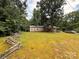 Cozy home with a charming covered porch and a large yard surrounded by mature trees at 370 Miracle Dr, Salisbury, NC 28146