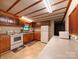 Traditional kitchen features oak cabinets, laminate countertops, and white appliances at 370 Miracle Dr, Salisbury, NC 28146