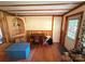 Cozy living room featuring wood paneling, trim, and a corner shelving unit at 370 Miracle Dr, Salisbury, NC 28146