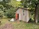 Exterior view of detached shed in wooded backyard at 370 Miracle Dr, Salisbury, NC 28146