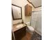 Bathroom with sliding glass door shower, dark wood vanity, and updated toilet at 400 Archibald Rd, Concord, NC 28025