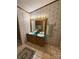 Vintage bathroom featuring dual sinks, a large mirror, and ceramic tile flooring at 400 Archibald Rd, Concord, NC 28025