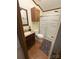 Bathroom with sliding glass door shower, dark wood vanity, and updated toilet at 400 Archibald Rd, Concord, NC 28025