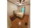 Cozy bedroom features wood floors, ceiling fan, and a comfortable bed with decorative pillows at 400 Archibald Rd, Concord, NC 28025