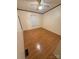 Empty bedroom features wood floors and a ceiling fan and natural light from the window at 400 Archibald Rd, Concord, NC 28025