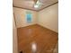 A bright bedroom featuring hardwood floors and a large window for natural light at 400 Archibald Rd, Concord, NC 28025