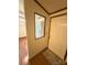 A welcoming entryway featuring a decorative mirror and a freshly painted front door at 400 Archibald Rd, Concord, NC 28025