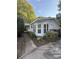 Inviting home exterior featuring manicured landscaping, a cozy entryway, and vibrant mulch beds enhancing curb appeal at 400 Archibald Rd, Concord, NC 28025