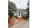 Inviting home exterior featuring manicured landscaping, a cozy entryway, and vibrant mulch beds enhancing curb appeal at 400 Archibald Rd, Concord, NC 28025