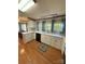 Cozy kitchen featuring white cabinets, modern countertops, and a stainless steel dishwasher, creating a functional space at 400 Archibald Rd, Concord, NC 28025