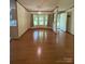 Inviting living room featuring hardwood floors and natural light from the bay window at 400 Archibald Rd, Concord, NC 28025
