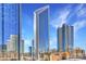Stunning skyline view featuring contemporary skyscrapers against a partly cloudy blue sky at 435 S Tryon St, Charlotte, NC 28202