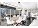 Bright dining room with crystal chandelier, ample seating, and city views at 435 S Tryon St, Charlotte, NC 28202