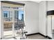 Bright room with exercise bike and a large window with views of the surrounding buildings at 435 S Tryon St, Charlotte, NC 28202